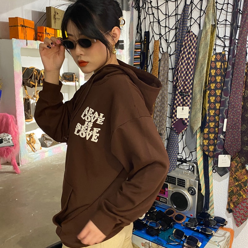Brown sweatshirt with an inscription